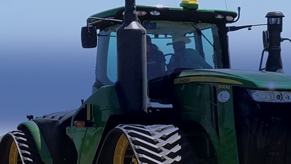 green tractor on the field running on renewable diesel